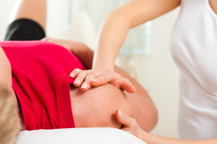 Physiotherapist doing her treatment at shoulder area