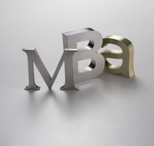 MBA - Master of Business Administration. Metal letters in soft diffuse light.