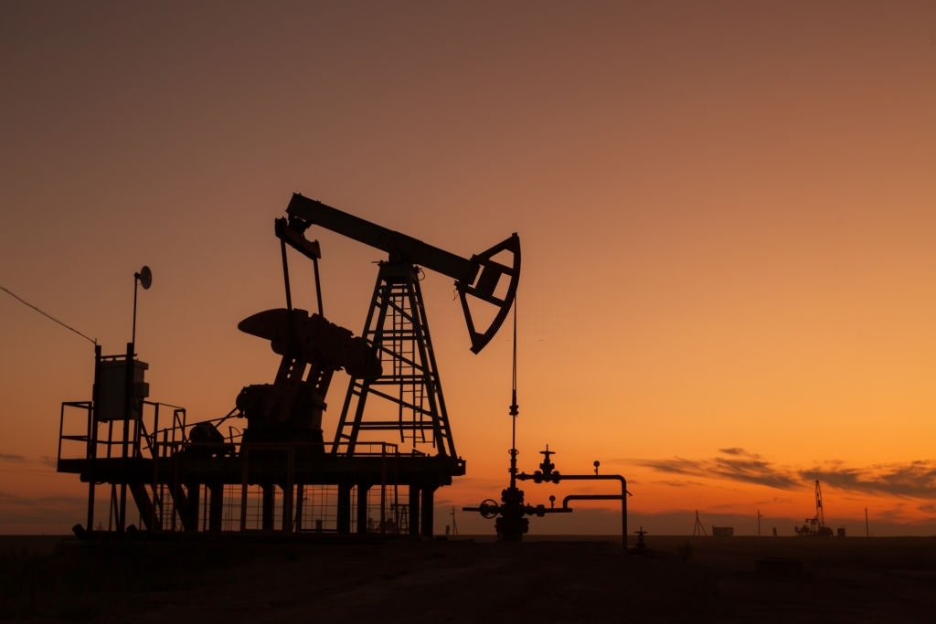 oil pumps at sunset, industrial oil pumps equipment.