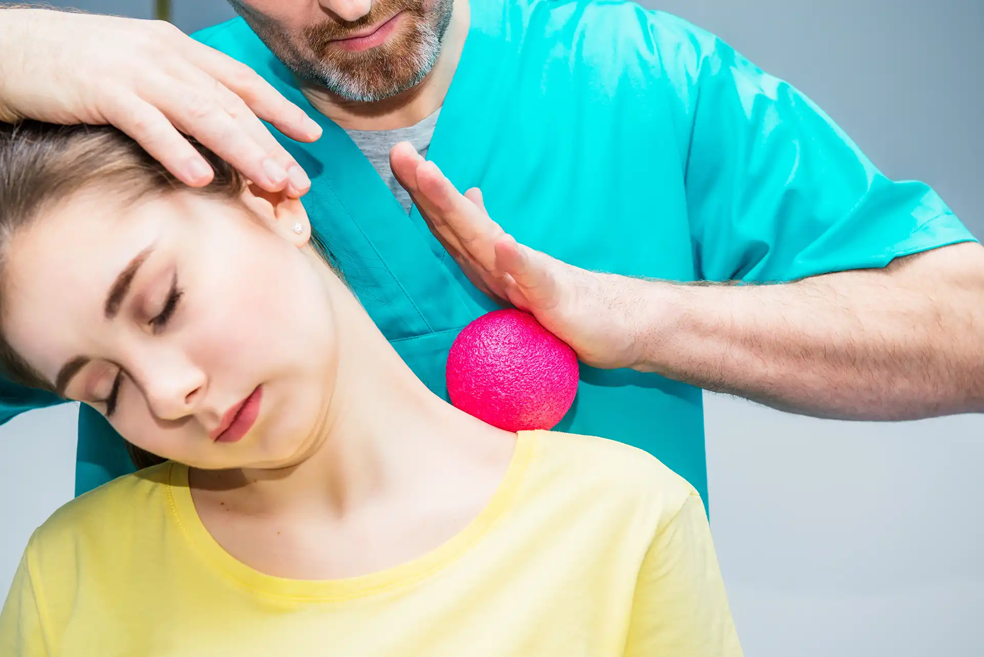 woman at the physiotherapy receiving ball massage
