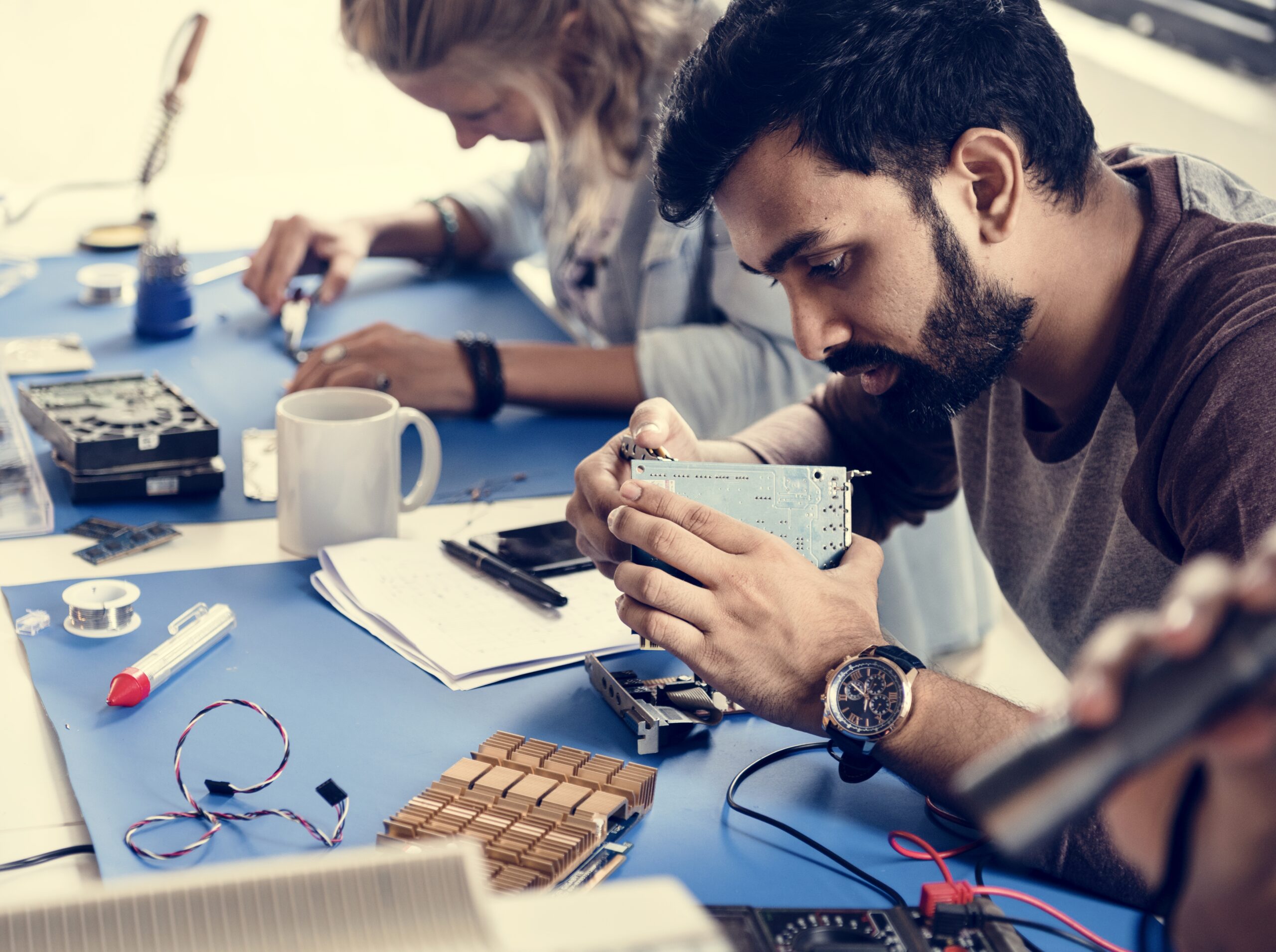 electrical technicians working on electronics